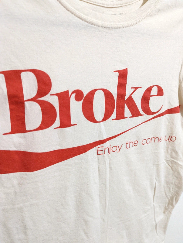 Cream short sleeve t-shirt with "Broke, enjoy the come up" graphic.

Brand
Broke Paid Rich

Material
100% cotton

Measurements
Men's Small
*for exact dimensions please refer to photos